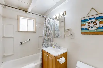 a bathroom with a sink and a toilet and a shower at Sailaway Cabin A in Ventura