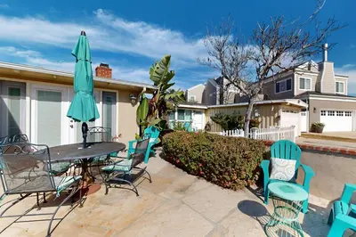 a patio with a table and chairs and an umbrella at Bangor Lane Oasis in Ventura