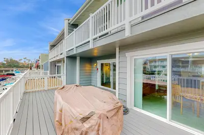 a balcony with a table on a house at Gateshead Haven in Oxnard