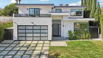 a white house with a garage at Curson Modern in Los Angeles