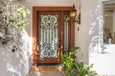 a front door with a wrought iron gate at Stradella Spanish in Los Angeles