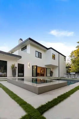 a house with a swimming pool in front of it at Sea Vista in Malibu
