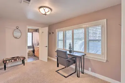 a home office with a desk and a window at Cozy Skyforest Cabin about 1 Mi to Lake Arrowhead! in Skyforest
