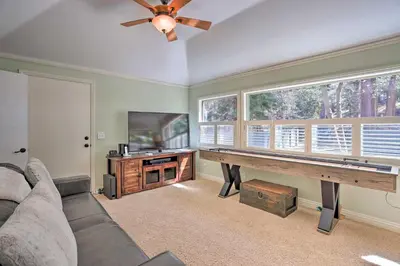 a living room with a ping pong table at Cozy Skyforest Cabin about 1 Mi to Lake Arrowhead! in Skyforest