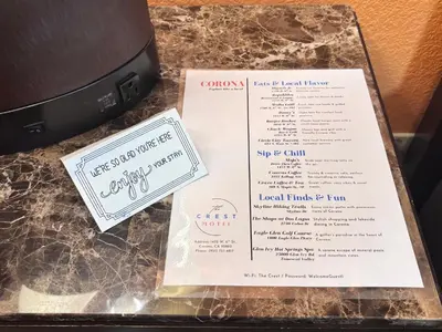 a table with two menus on top of a table at The Crest Motel in Corona