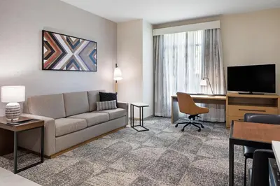 a living room with a couch and a desk at Residence Inn by Marriott Chatsworth in Chatsworth