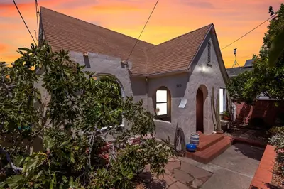 a small house with a sunset in the background at Cedar Oasis in Ventura
