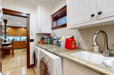 a kitchen with a sink and a washing machine at Highland Park Haven in Los Angeles