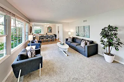 a living room with two couches and a table at Evening Oasis in Orange