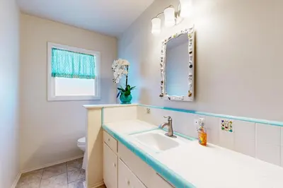 a bathroom with a sink and a mirror at Evening Oasis in Orange