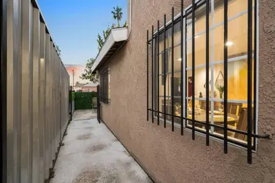 an empty alleyway between two buildings with windows at The Avalon - 35 Percent Off March! in Los Angeles
