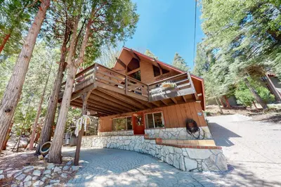 a house with a balcony on top of a building at Annandale Manor in Lake Arrowhead