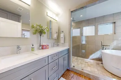 a bathroom with a tub and a sink and a shower at Brockton Diamond in Ventura