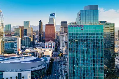 a view of a city with a nrys sign on a building at Moxy Downtown Los Angeles in Los Angeles