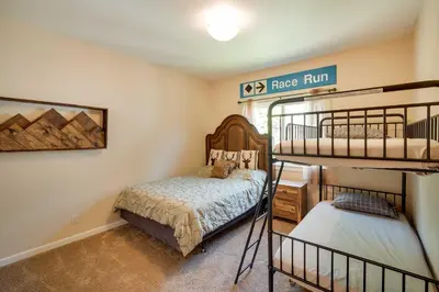 a bedroom with two bunk beds and a bunk bed at Lake Arrowhead Getaway with Decks and Game Room! in Lake Arrowhead