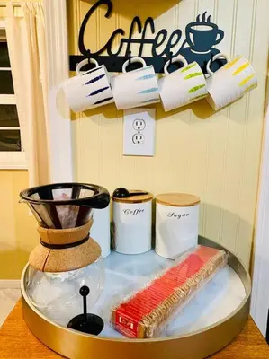 a counter top with a shelf with cups and a blender at Snow Bunny Cottage, Pets Welcomed! in Green Valley Lake