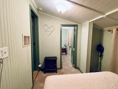 a room with a bed and a heart on the wall at Snow Bunny Cottage, Pets Welcomed! in Green Valley Lake