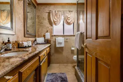 a bathroom with a sink and a toilet at Cozy Hygge Home Centrally Located 2 King Beds in Bakersfield
