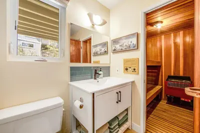 a bathroom with a sink and a toilet and a tub at Timber Top Retreat in Lake Arrowhead