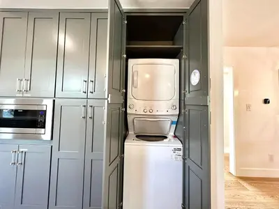 a kitchen with a refrigerator and a microwave at #Marbella Lane - Cozy Modern Home with Relaxing Design & Pool in Fullerton