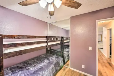 a room with a bunk bed and a mirror at Bright California Home with Patio Less Than 1 Mi to Hiking! in Corona