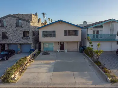 an empty driveway in front of a house at Ocean View / Pool Table / Surfboards / Beach Bikes in Oxnard