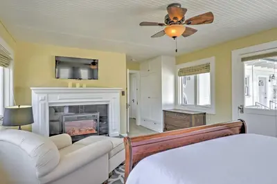 a living room with a couch and a fireplace at Carpinteria Apt with Hot Tub - 10 Min Walk to Beach! in Carpinteria