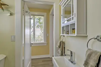 a bathroom with a sink and a window at Carpinteria Apt with Hot Tub - 10 Min Walk to Beach! in Carpinteria