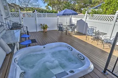 a hot tub on a deck with a table and chairs at Carpinteria Apt with Hot Tub - 10 Min Walk to Beach! in Carpinteria