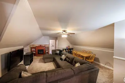 a living room with a couch and a table at TheDragon's Den Mega Cabin Sleeps 12 in Lake Arrowhead
