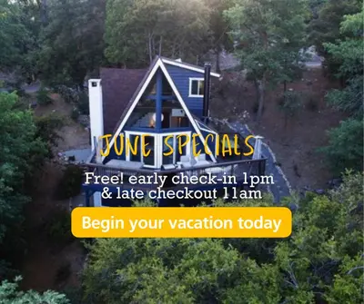 a house with a sign that reads feed early check in june and late checkout at Roots Mountain House Modern A-Frame in Lake Arrowhead