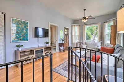 a living room with a couch and a tv at Charming Santa Paula Home - Walk to Downtown! in Santa Paula