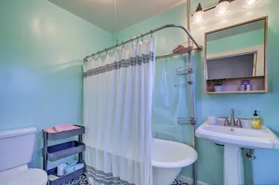 a bathroom with a shower curtain and a sink at Charming Santa Paula Home - Walk to Downtown! in Santa Paula