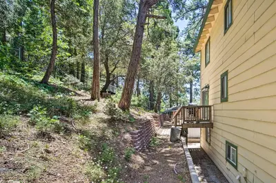 a house with a deck on the side of it at Cozy Crestline Getaway about 2 Mi to Lake Gregory in Crestline