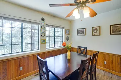 a dining room with a table and a ceiling fan at All-Season Crestline Escape - 2 Mi to Lake! in Crestline