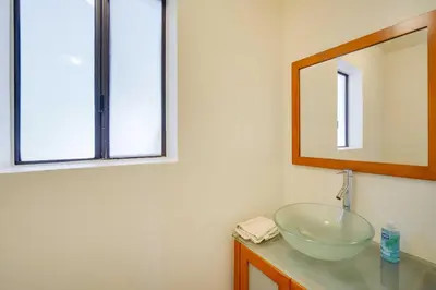 a bathroom with a bowl sink and a mirror at All-Season Crestline Escape - 2 Mi to Lake! in Crestline