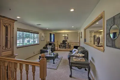 a living room with a couch and a table at Spacious Lancaster Family Ranch - BBQ and Patio in Lancaster