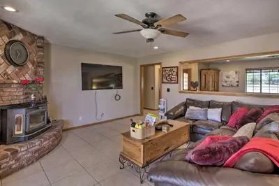 a living room with a couch and a fireplace at Spacious Lancaster Family Ranch - BBQ and Patio in Lancaster