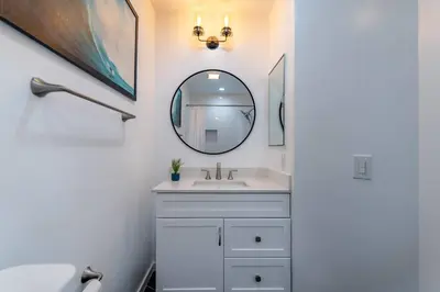 a bathroom with a sink and a mirror at Franklin Hollywood Bowl Loft in Los Angeles