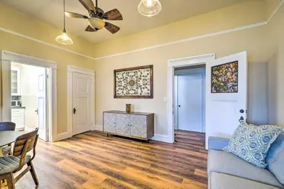 a living room with a couch and a ceiling fan at Cozy Carpinteria Apartment Walkable Location in Carpinteria