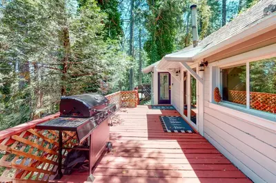 a grill on the front porch of a house at Top Town Retreat in Crestline