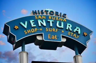 a sign for a sign for a movie theater at The Green Haven, 1 Minute Walk to the Beach and Restaurants, King Beds, Beach Amenities in Ventura