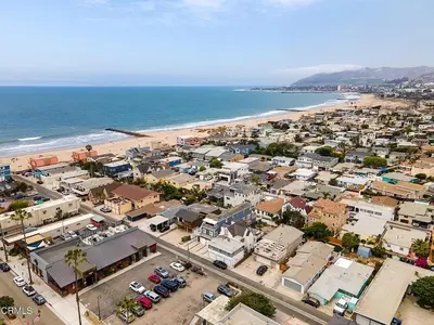an aerial view of a town next to the beach at The Green Haven, 1 Minute Walk to the Beach and Restaurants, King Beds, Beach Amenities in Ventura