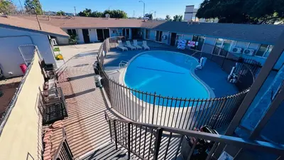 an overhead view of a swimming pool on a balcony at Lanai Motel in Alhambra