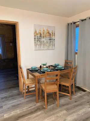 a dining room with a wooden table and chairs at Cozy Lake-View Lodge Near Village in Big Bear Lake