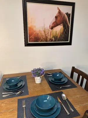 a table with a picture of a horse on the wall at Cozy Lake-View Lodge Near Village in Big Bear Lake