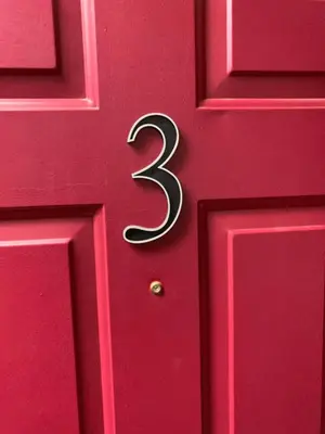a red door with a number three on it at Cozy Lake-View Lodge Near Village in Big Bear Lake