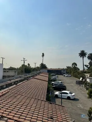 a group of cars parked in a parking lot at Stardust inn in Azusa