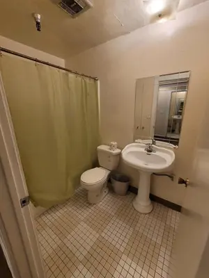 a bathroom with a toilet and a sink at (A11) Lovely Double Bed Unit in Los Angeles