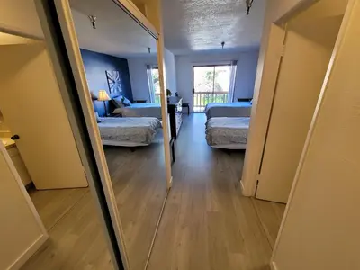a view of a bedroom with two beds and a mirror at (B02) Cozy Double Bed Suite in Los Angeles